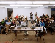 A portrait of an audience at a Cal Arts lecture by Tim Davis.